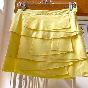 NEW WITH TAGS! ADD SUNSHINE TO YOUR WARDROBE WITH A BEAUTIFUL YELLOW MINI SKIRT